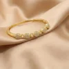 AD Studded Floral Cluster Design Openable Kada for Women – Elegant Gold Finish Wristwear by ANKKSHMI