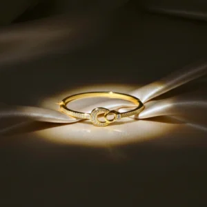 AD Studded Interlocking Double Circle Openable Kada for Women – Elegant Gold Finish Wristwear by ANKKSHMI