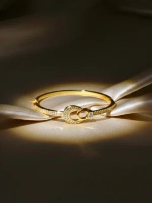 AD Studded Interlocking Double Circle Openable Kada for Women – Elegant Gold Finish Wristwear by ANKKSHMI