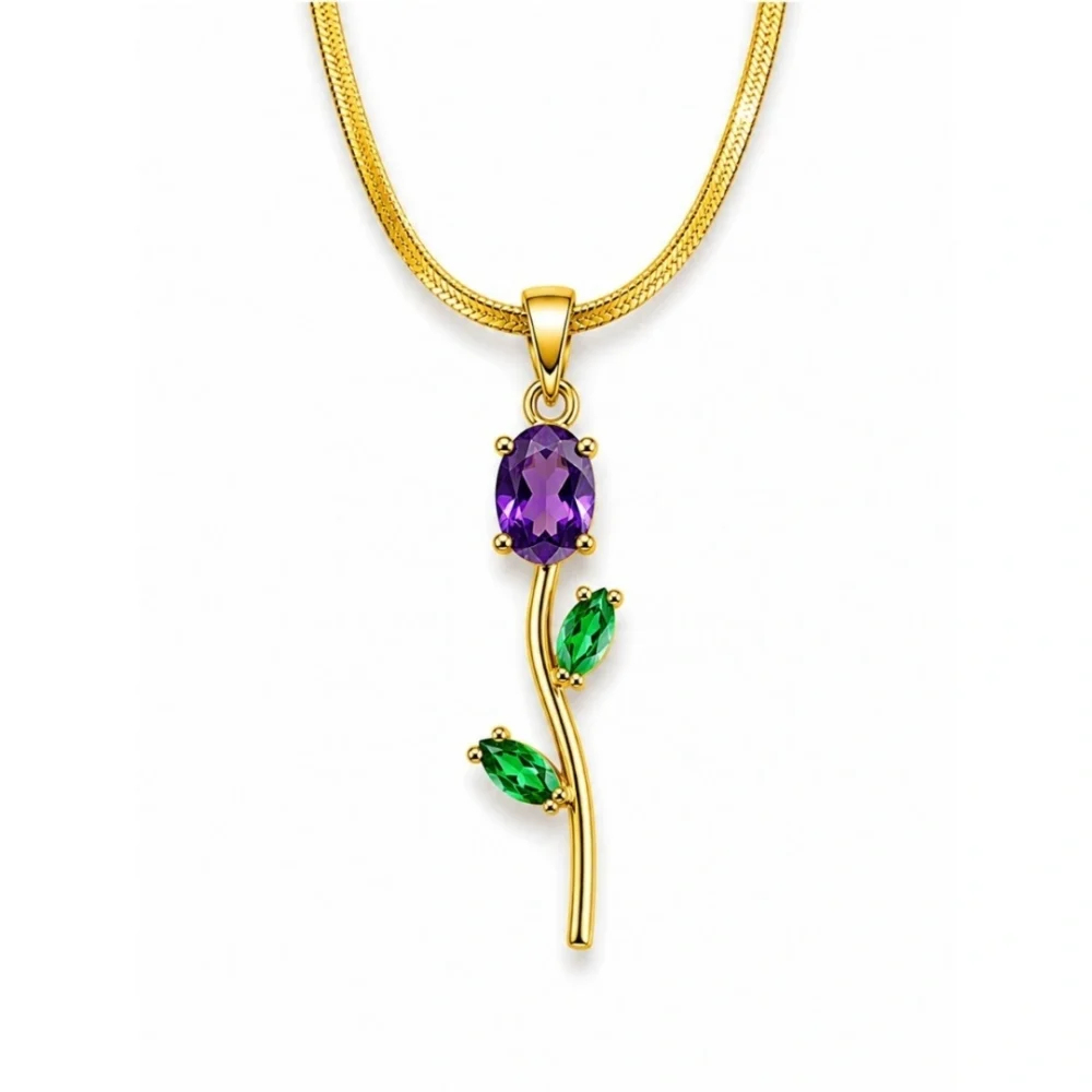 Gold floral pendant necklace with purple and green gemstone accents on a white background