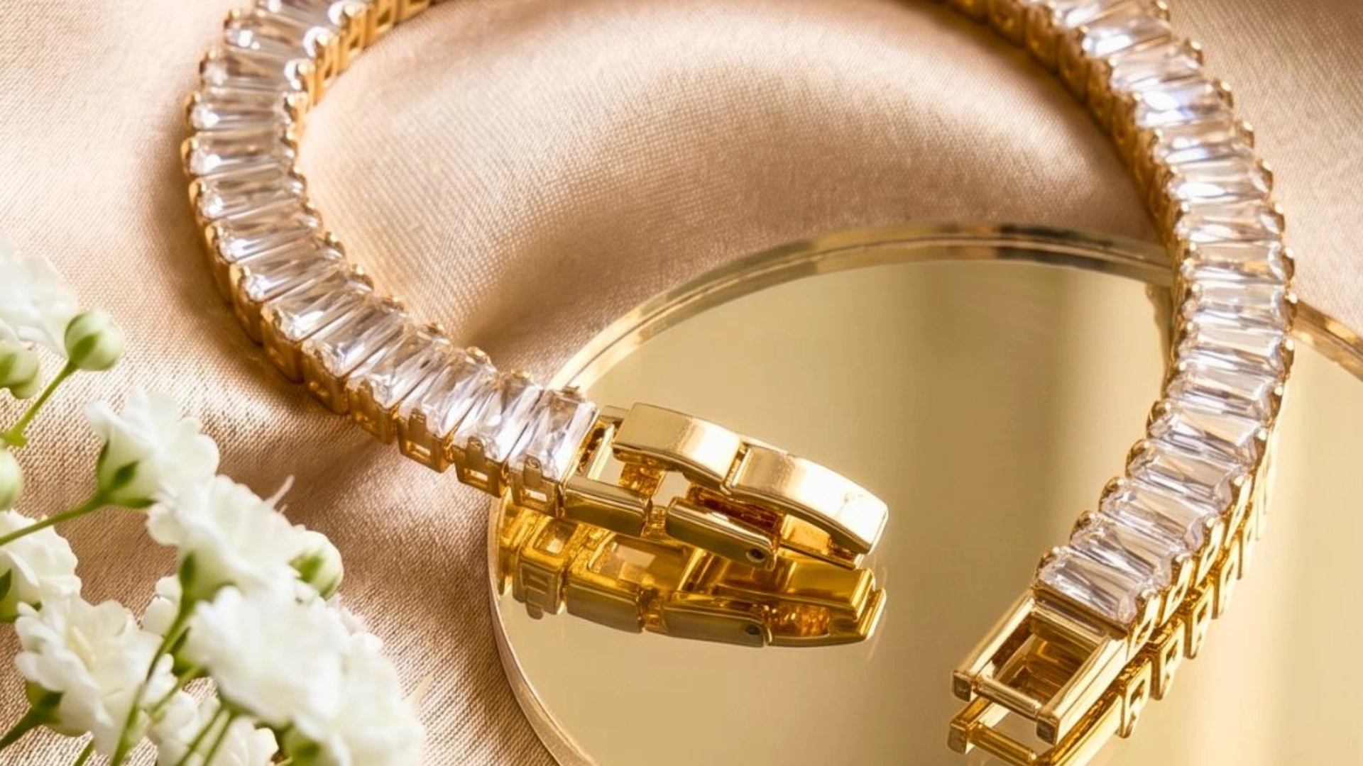 Gold-plated tennis bracelet with sparkling baguette stones styled for everyday wear, festive occasions, and wedding jewellery looks.